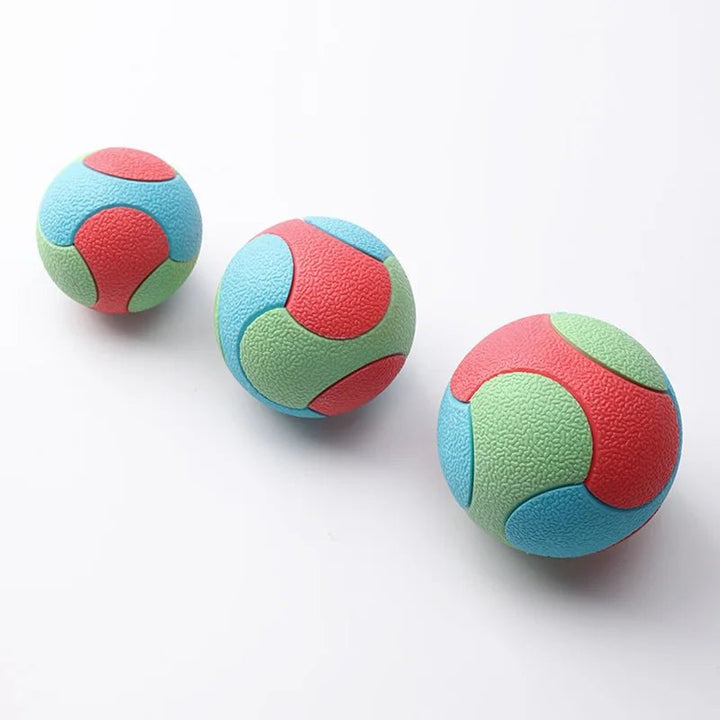 Collection of colorful durable canine balls; pet supplies for training & dental health