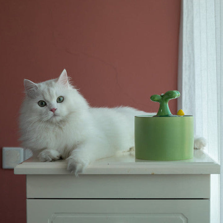 Ceramic pet fountain with activated carbon filter, providing clean and fresh drinking water for pets.