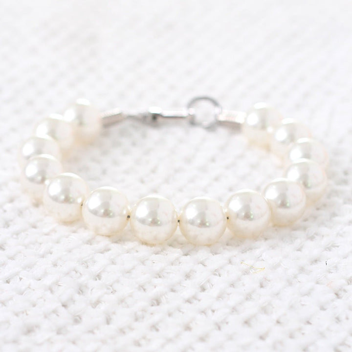 Elegant pearl beaded necklace for small dogs, featuring a secure clasp and lustrous faux pearls