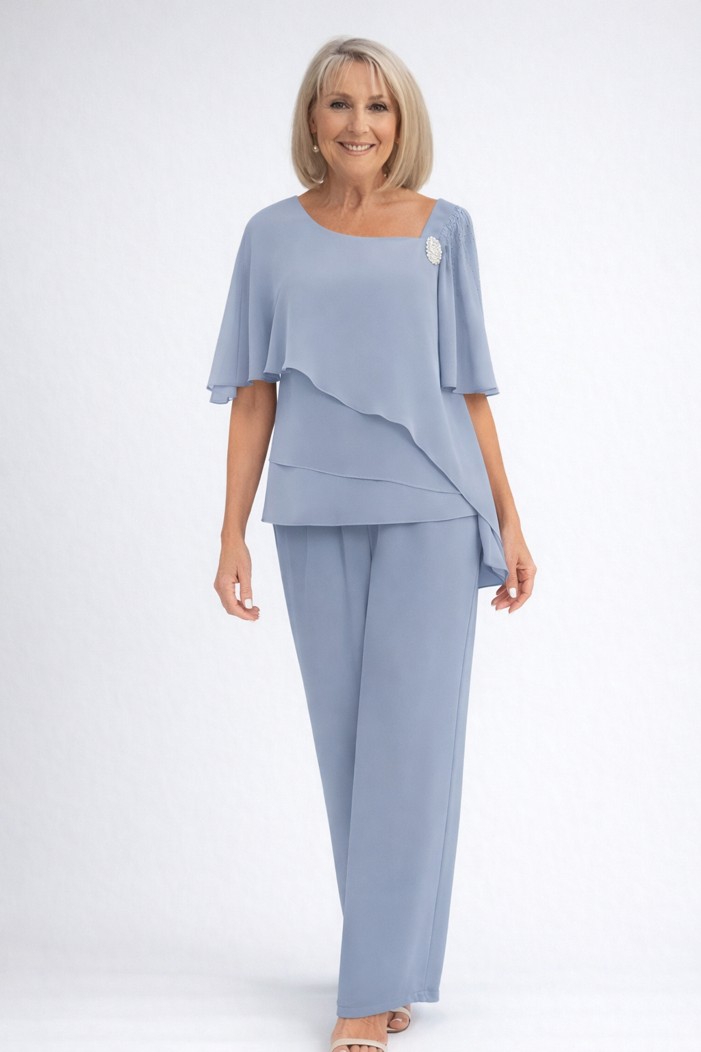 Elegant women's cape top & tailored trouser set, perfect for formal events & sophisticated occasions.