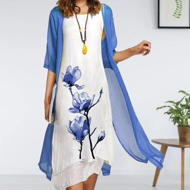 Chic women's floral print midi dress and sheer cardigan set, featuring a layered look for elegant summer style.
