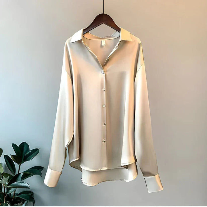 Elegant women's relaxed fit long sleeve button down blouse. Perfect for work or casual chic style.