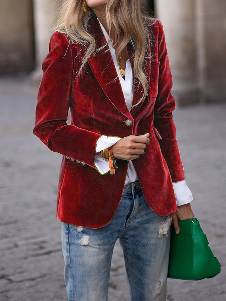 Elegant women's tailored velvet blazer with chic gold buttons, perfect for formal or office wear.