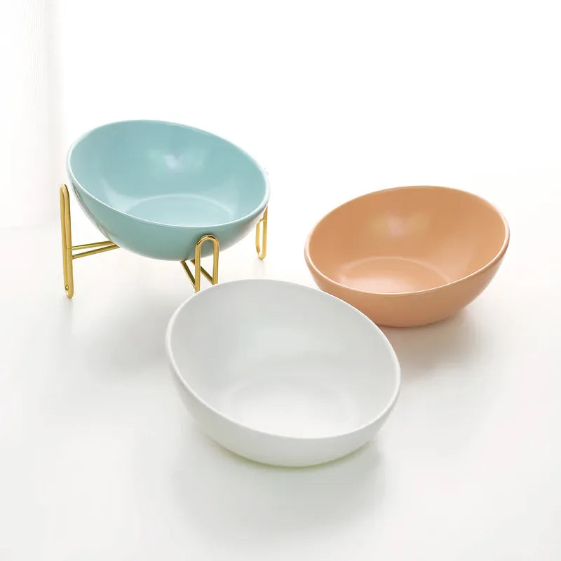 Close-up of white ceramic bowl in elevated pet feeder, sturdy base, perfect for dog or cat food and water