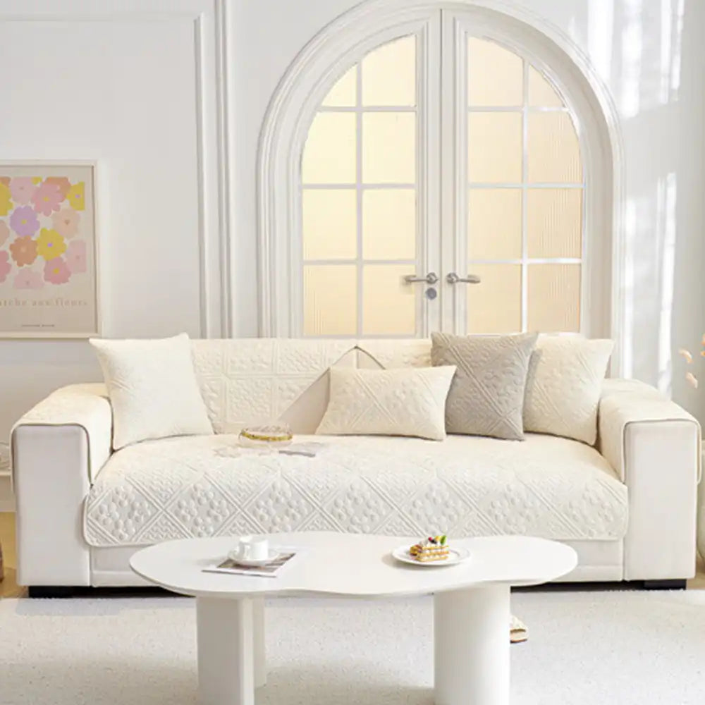 Grey embossed geometric quilted sofa cover, perfect for furniture protection and pet-friendly homes.