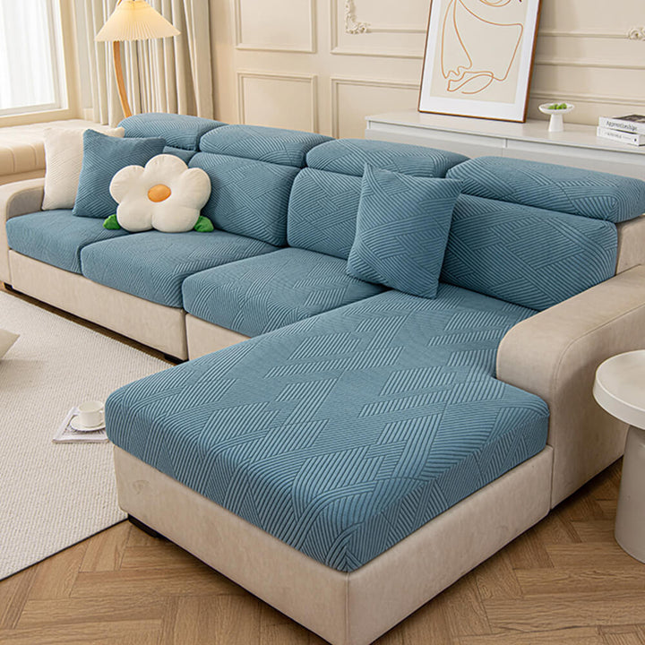 Machine washable geometric jacquard sofa cover, practical and pet-friendly living room solution.