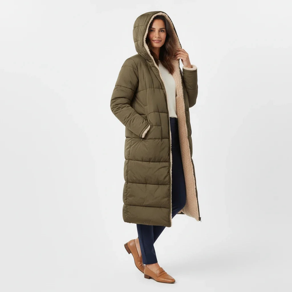 Stylish women's long-line puffer coat, hooded and perfect for winter fashion.