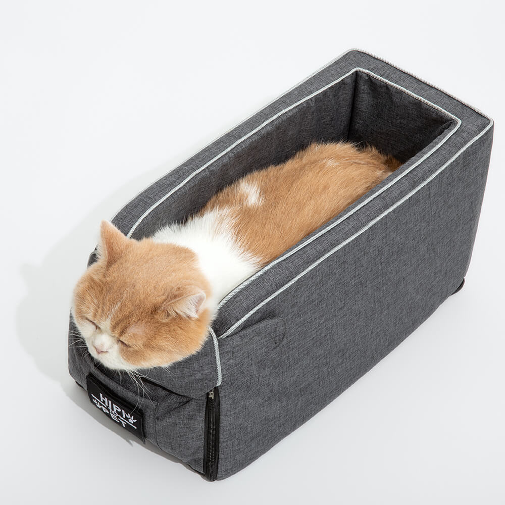 Grey console car seat for pets, featuring a comfortable suede bed and safety features