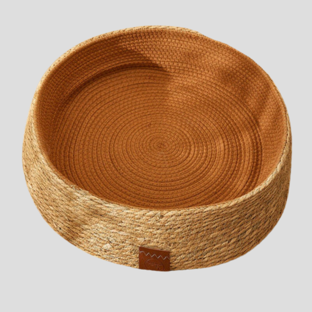 Hand-woven rattan cat bed with built-in scratching surface for pet comfort, brown & dark green.