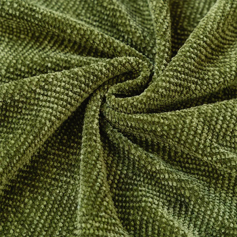 Full view of a living room sofa covered with a stylish herringbone chenille pet cover
