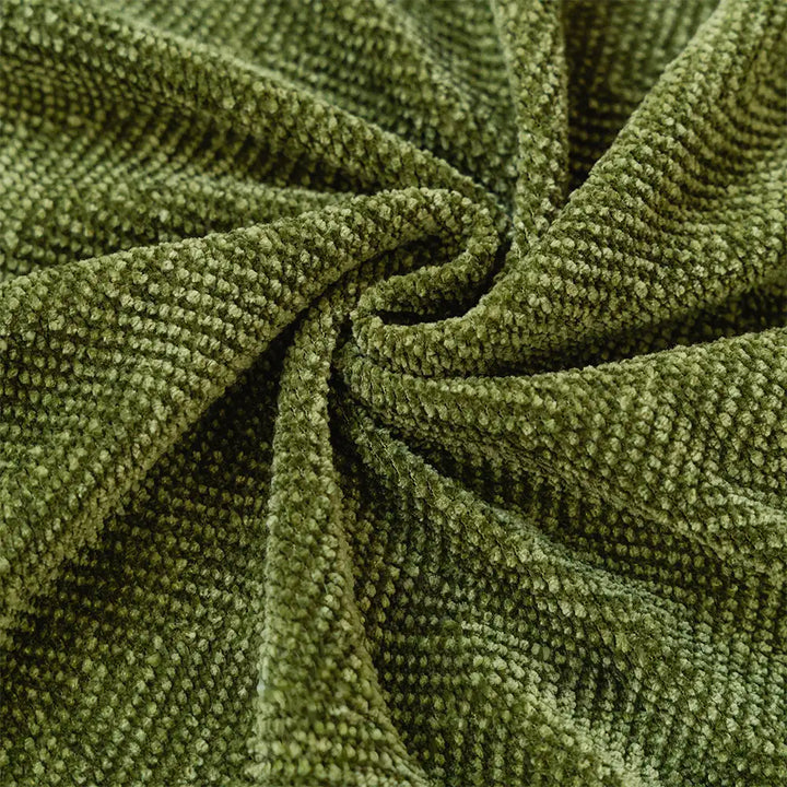 Full view of a living room sofa covered with a stylish herringbone chenille pet cover
