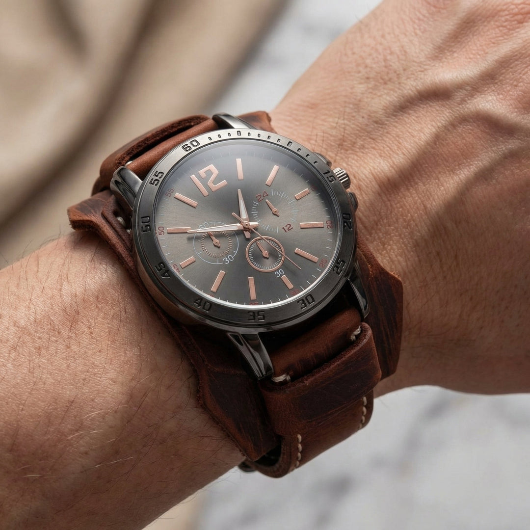 Distressed brown leather strap on a men's oversized vintage watch. Rugged, punk, and street style ready.