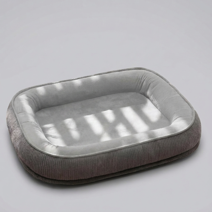 Premium scratch-resistant pet bed with a soft fleece interior, designed for comfort and durability for medium & large dogs.