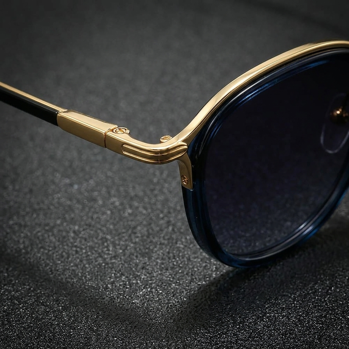 Gold Elvian round frame sunglasses, a sleek unisex fashion accessory for sunny days.