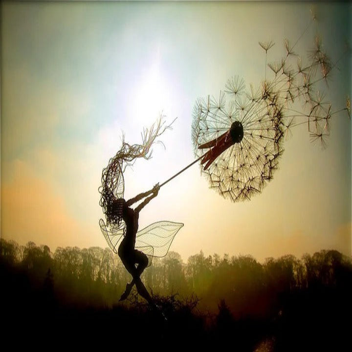 Decorative metal dandelion art with a delicate fairy, sturdy outdoor garden stake.