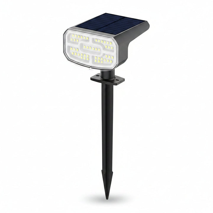 Waterproof cool white LED solar spotlights, 4-pack, with ground stake & wall mount. Ideal for exterior lighting.