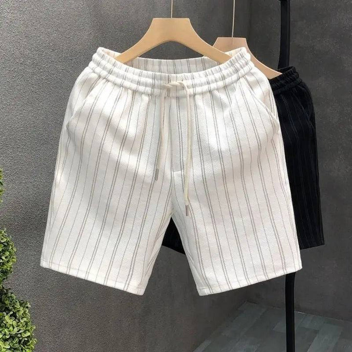 Comfortable men's ivory pinstripe tailored shorts. Features elastic waist & drawstring, ideal for casual summer style.