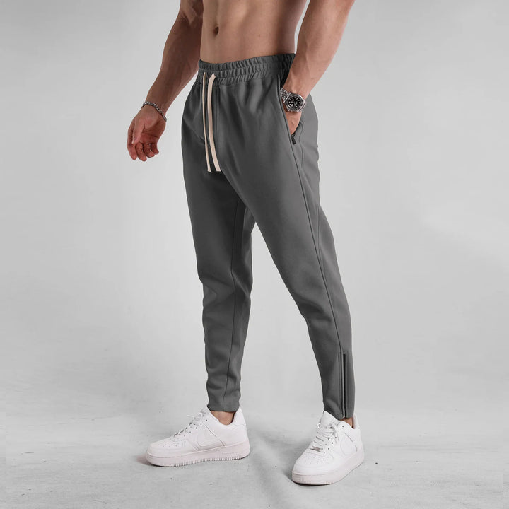 Comfortable men's Girona tapered joggers. Lounge-ready sweatpants with zip hems for daily wear.