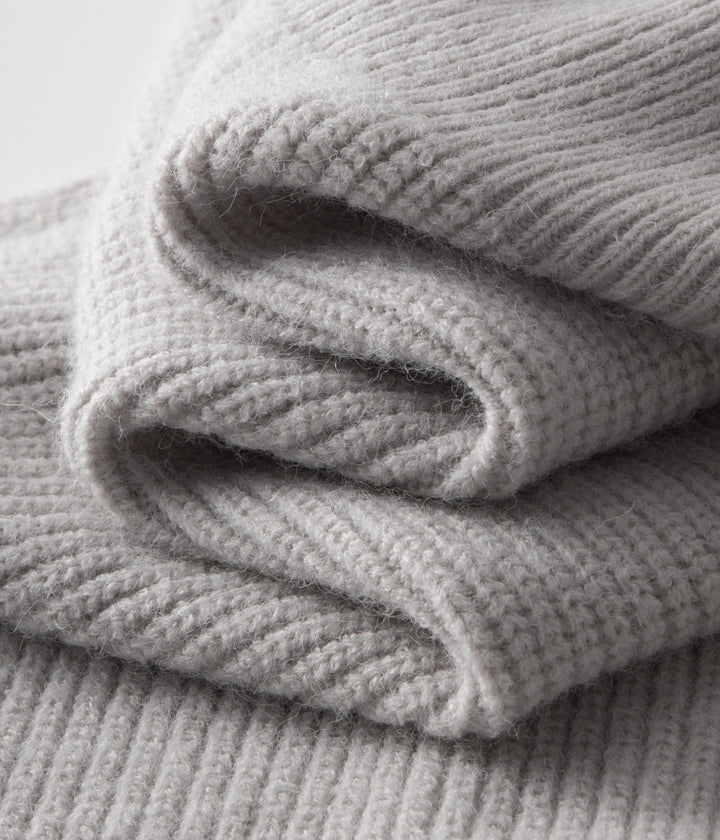 All-season men's ribbed knit jacket. Funnel neck zip-up, great for stylish layering.