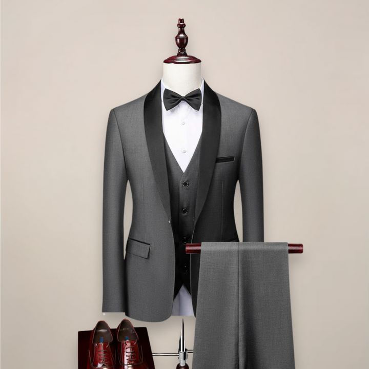 Stylish men's slim fit three-piece tuxedo, ideal for black tie, weddings, and formal business attire.