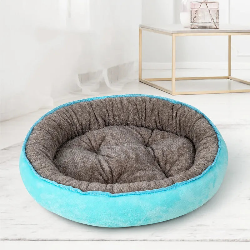 Soft cushion dog bed, donut shape in gray with non-slip bottom, perfect for cozy pets