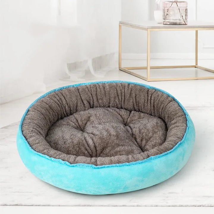 Soft cushion dog bed, donut shape in gray with non-slip bottom, perfect for cozy pets