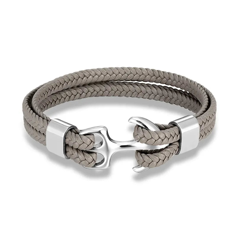 Men's rugged leather and anchor bracelet, adding a touch of nautical flair to his outfit.