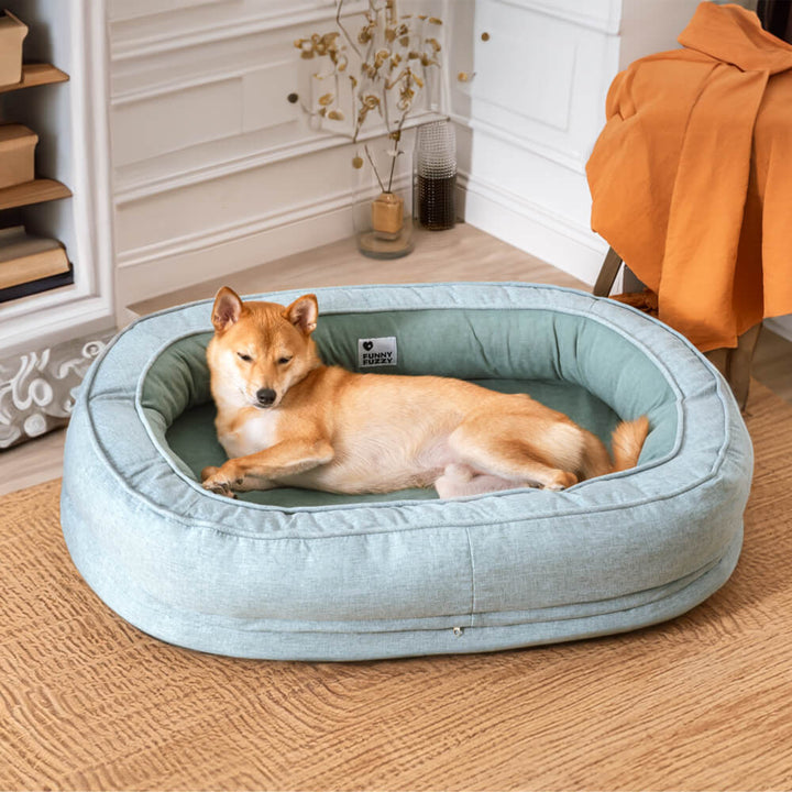 Washable orthopedic pet bed in a donut design, for easy cleaning and pet comfort.