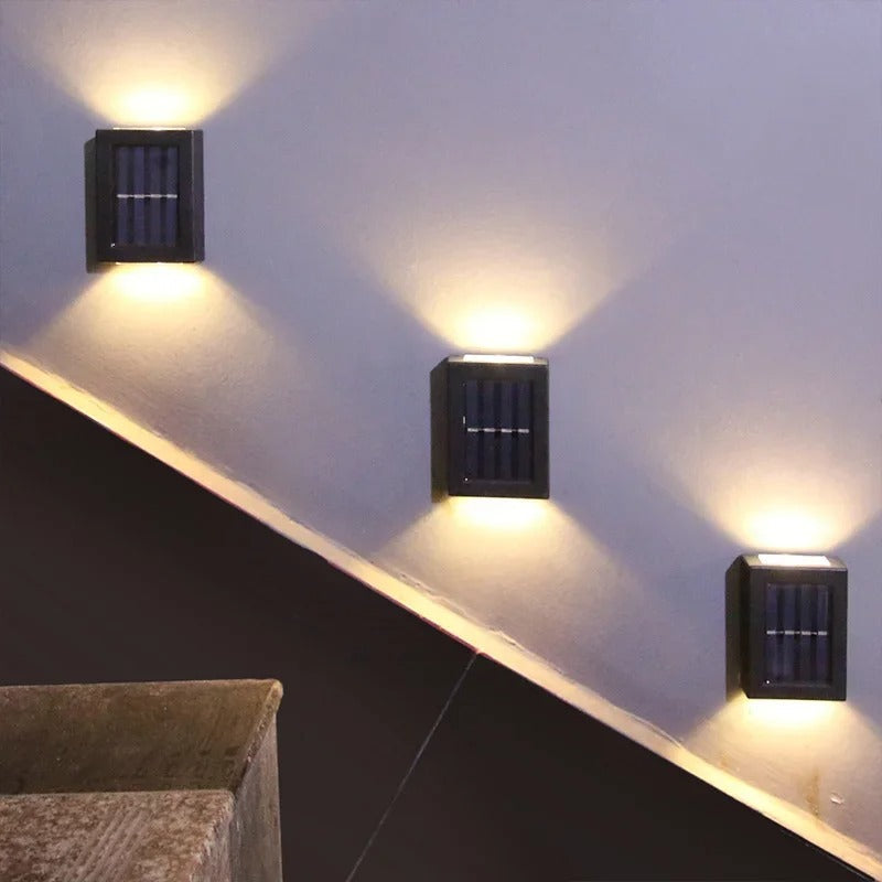 Decorative outdoor solar LED garden wall light provides bright, wireless illumination for pathways & patios.