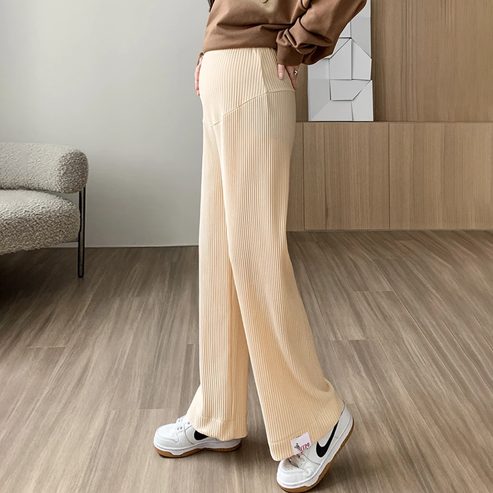 Flattering high-waist ribbed maternity pants, with a wide-leg design for comfortable wear during pregnancy.
