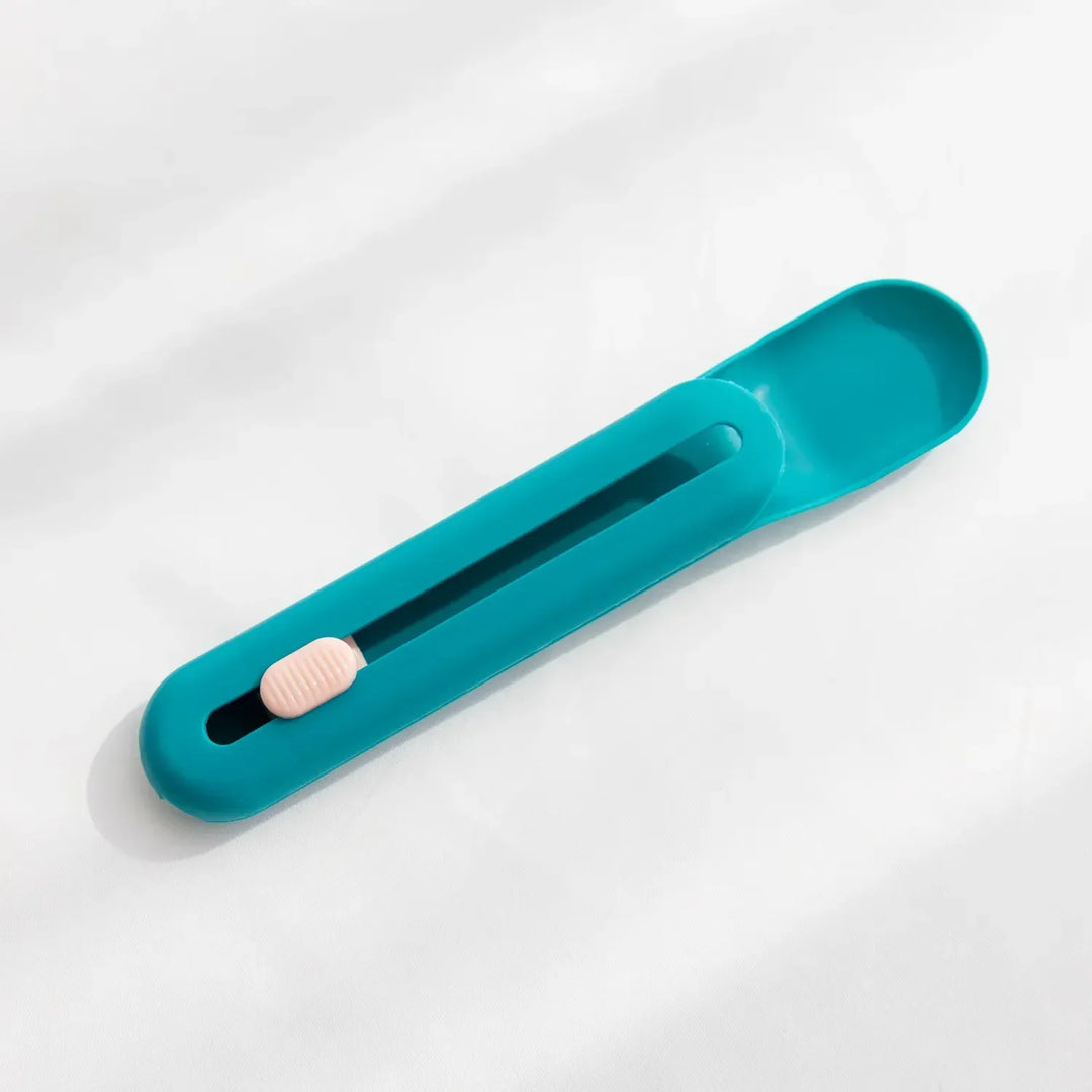 Cat food dispenser spoon with comfortable grip handle and measuring slider