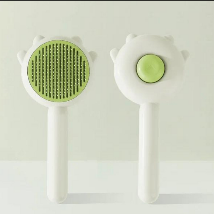 Close-up of a cat brush with ergonomic handle, designed for effective hair removal and feline grooming