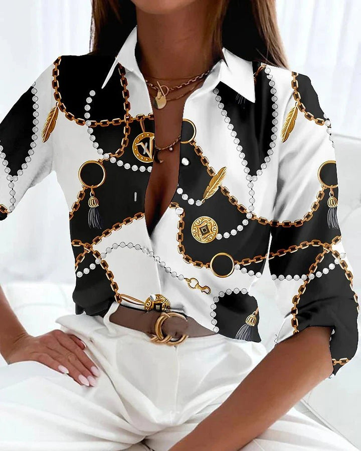 Fashionable women's plus size shirt with an eye-catching geometric print and classic button-up front. Ideal for all occasions.