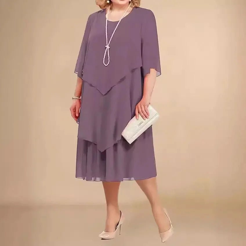 Flowy plus size purple chiffon dress featuring an asymmetrical layered knee-length skirt & comfortable 3/4 sleeves.