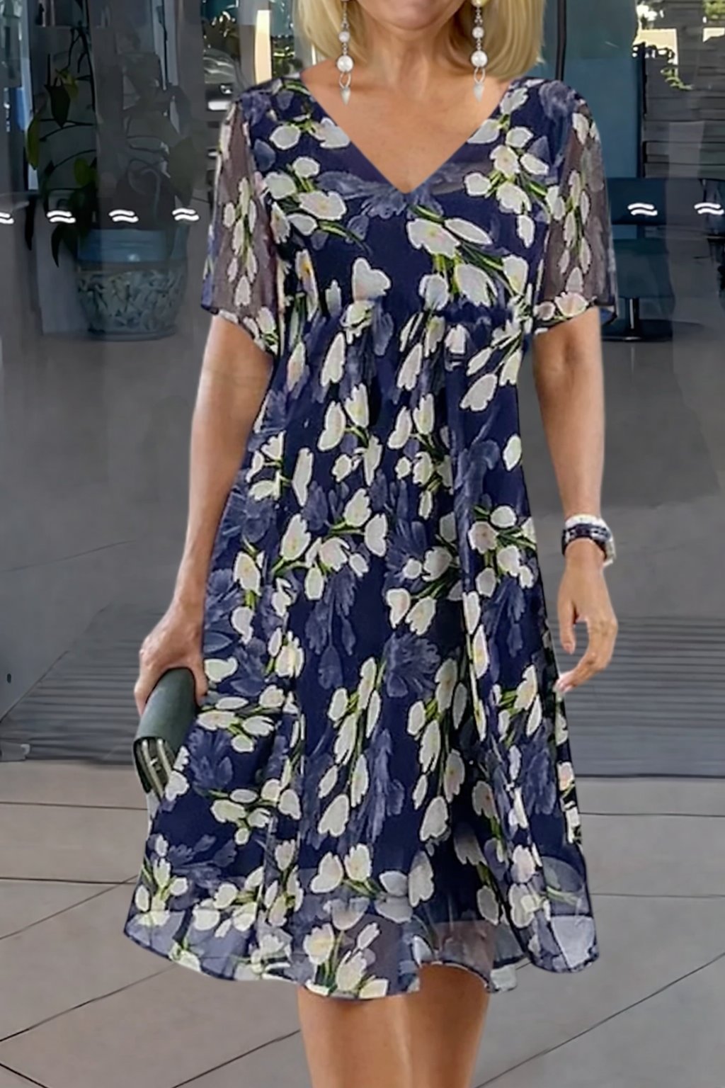 Women's plus size floral midi dress with V-neck and short sleeves. Elegant and comfortable A-line summer dress.