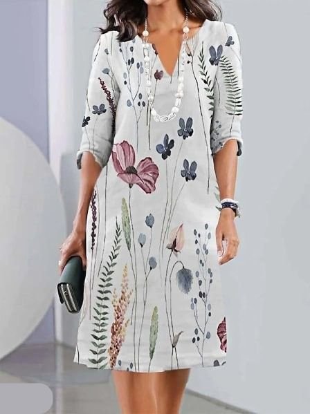 Casual plus size floral A-line midi dress for women. Features short sleeves and a flattering V-neck, perfect for summer.