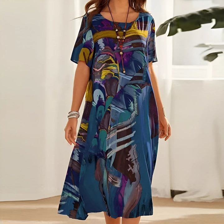 Women's plus size abstract print maxi dress, short sleeve, ideal casual summer and vacation wear for comfort.