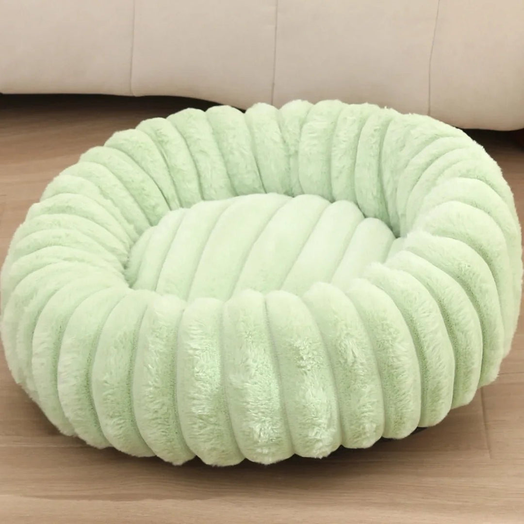 Fluffy plush donut bed, a cozy pet essential and calming bed for small to medium dogs.