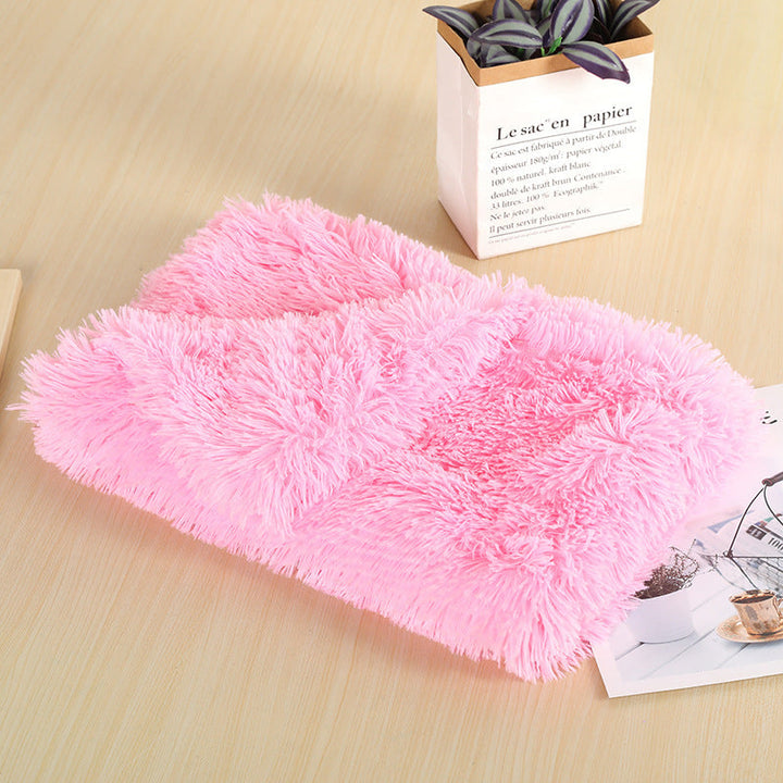 Cat nestled on a warm plush pet blanket, washable and cozy bed for pets