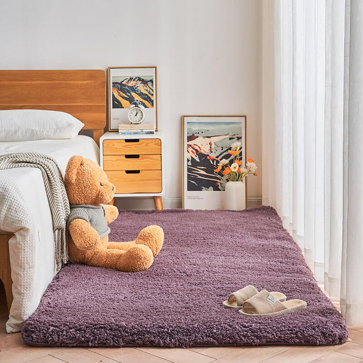 Beige plush shaggy area rug, cozy non-slip bedroom carpet providing soft floor comfort, polyester.