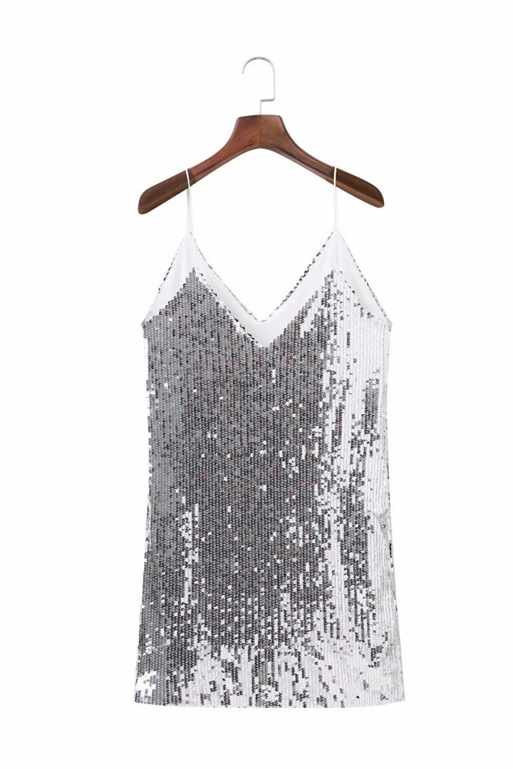 Glamorous women's sequined party mini dress. Sparkle in this silver cocktail attire, ideal for evening events.
