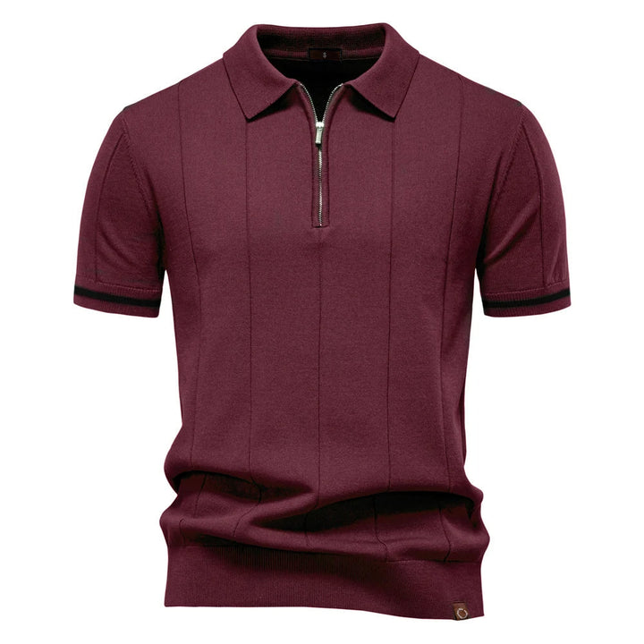 Modern men's quarter-zip polo top, knit material ensures comfort and a sophisticated casual look.