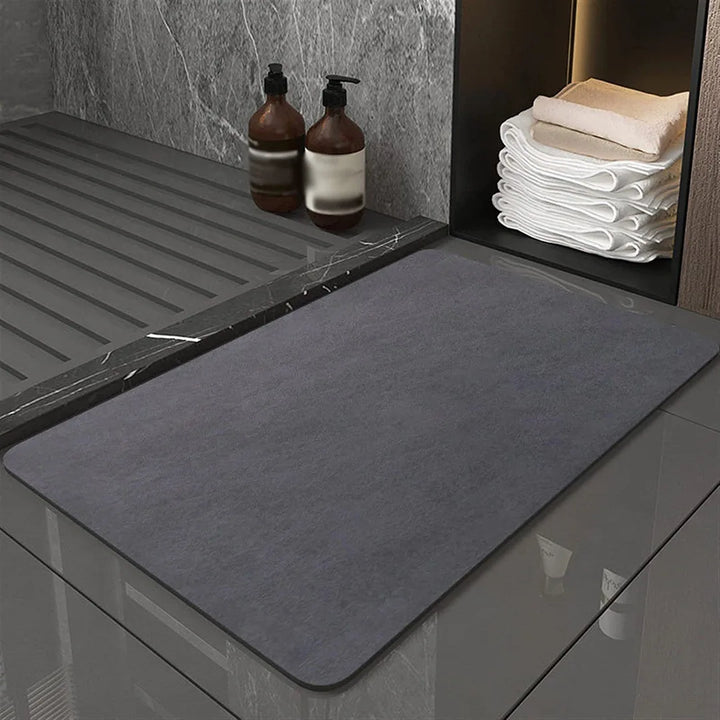 Super absorbent quick-dry diatomite bathroom mat. Anti-slip safety for shower or bath. Modern home living.