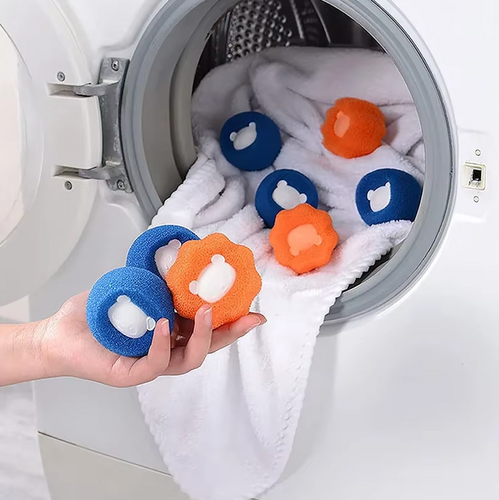 A pile of clean, lint-free clothes, achieved using pet hair remover dryer balls.