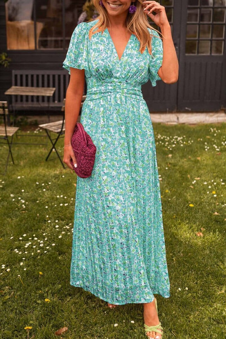 Vibrant floral V-neck maxi dress, a comfortable and elegant long dress for women attending summer weddings or parties.