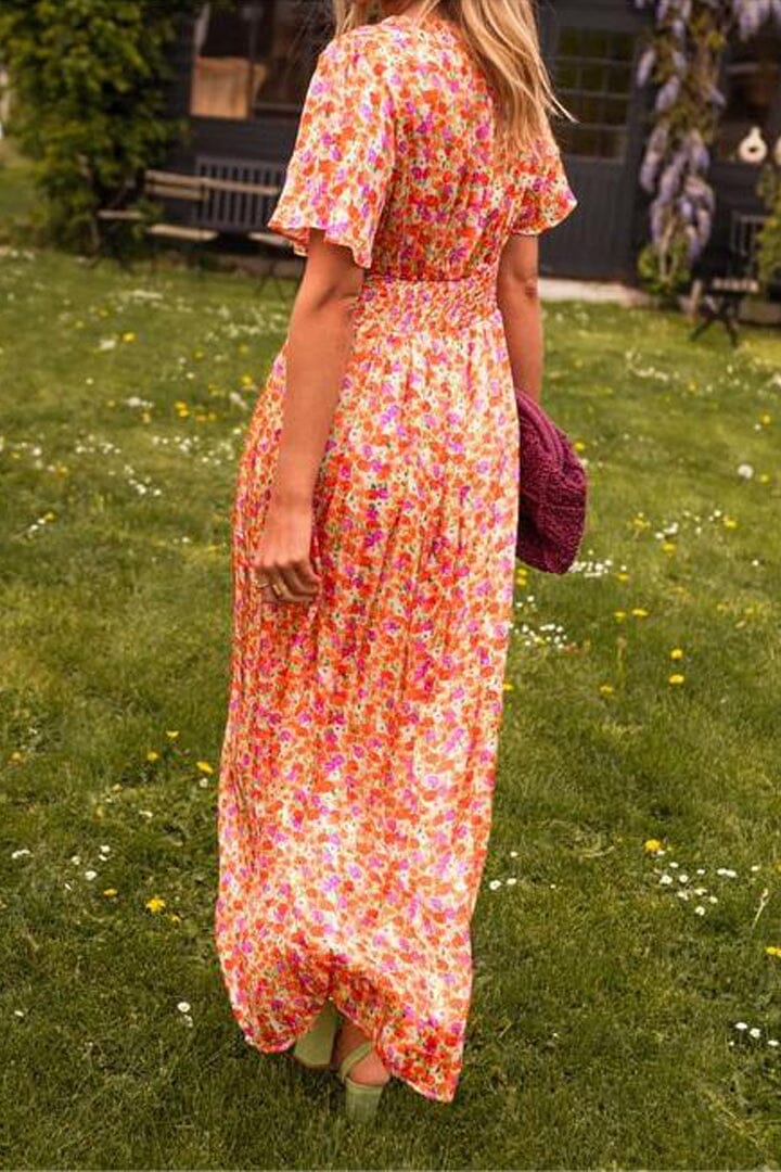 Flowing V-neck floral maxi dress for women, ideal as an elegant wedding guest outfit or summer party dress.