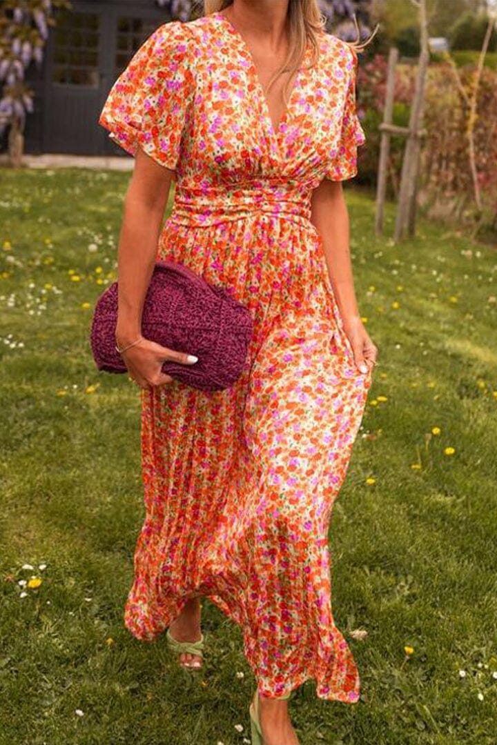 Vibrant floral print maxi dress, a perfect long summer or spring dress for women attending a wedding or special event.