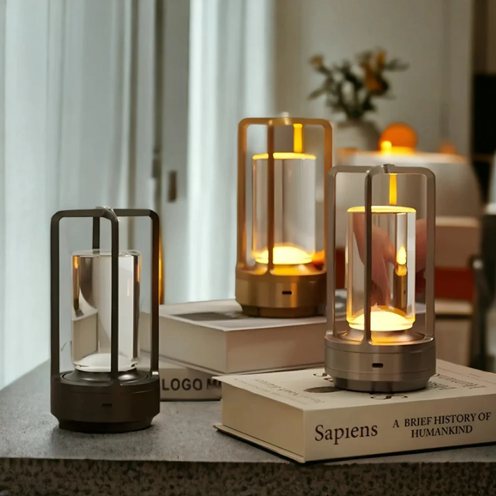 Rechargeable wireless LED table lamp with crystal detail & metal cage. Dimmable, portable, touch control home lighting.