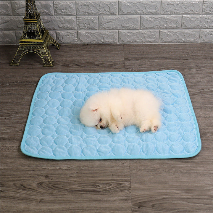 Cat napping peacefully on a square cooling gel mat, perfect pet bed for summer