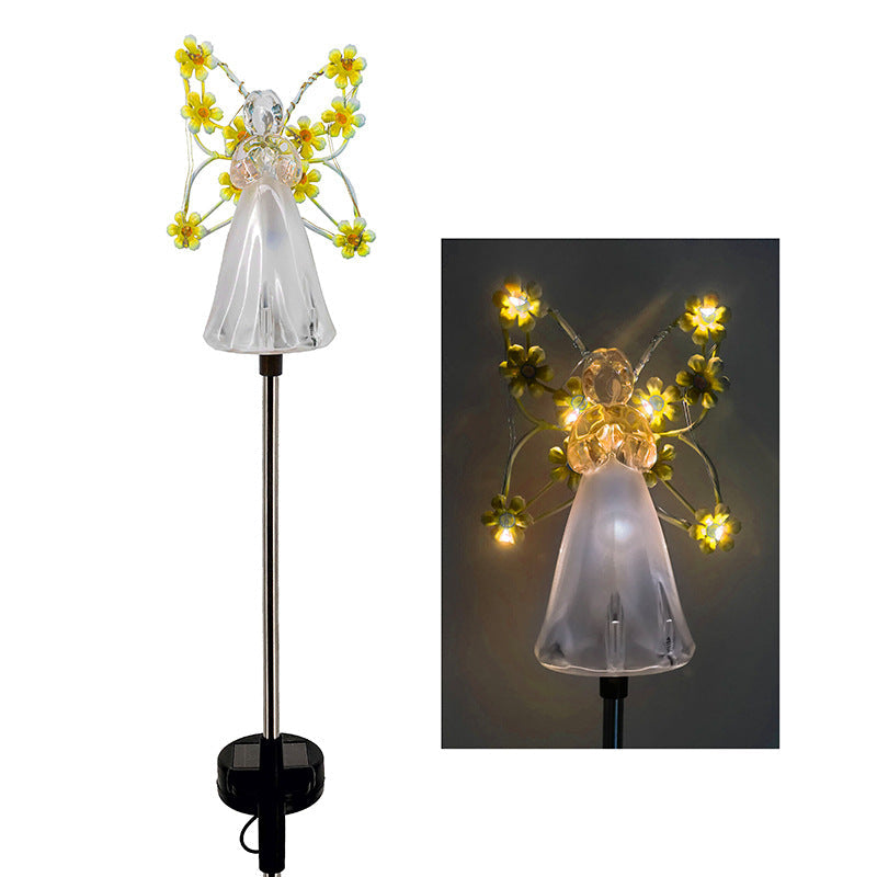 Weatherproof solar angel light illuminating a garden path, an attractive and functional outdoor lighting solution.